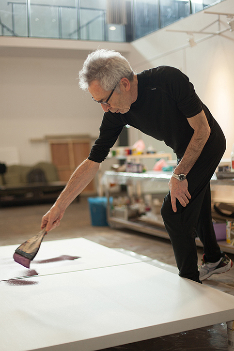 Terry Rose painting in his studio